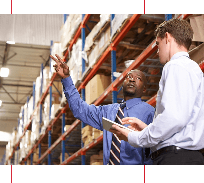 A Person Pointing at Something in a Warehouse